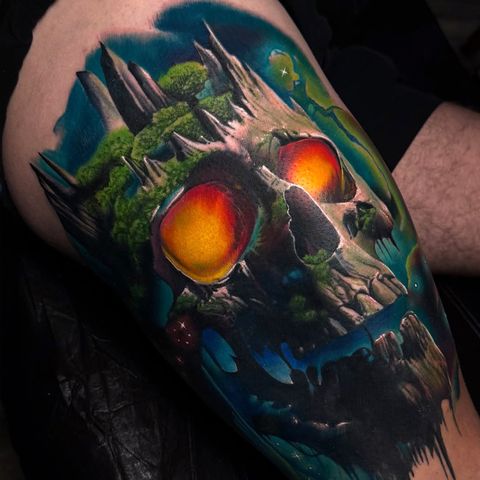 Surreal skull landscape color tattoo