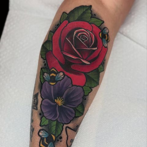 Red rose and purple pansy with bees tattoo