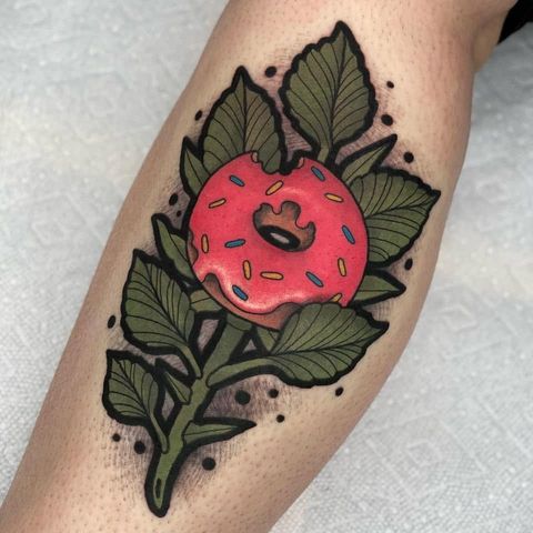 Pink donut on a branch tattoo