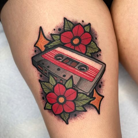 Cassette tape with flowers tattoo